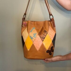 SOLD Mario Hernandez bucket bag from the Mariposa collection